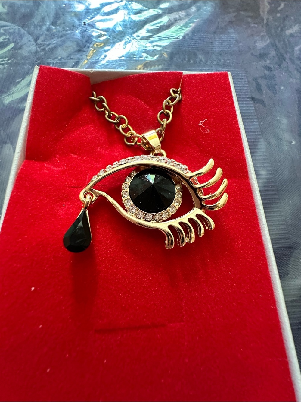 Gold-Tone Eye Pendant Necklace with Black Crystal Teardrop